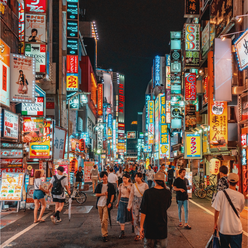 Neon city street at night for MASX after-dark culture travel